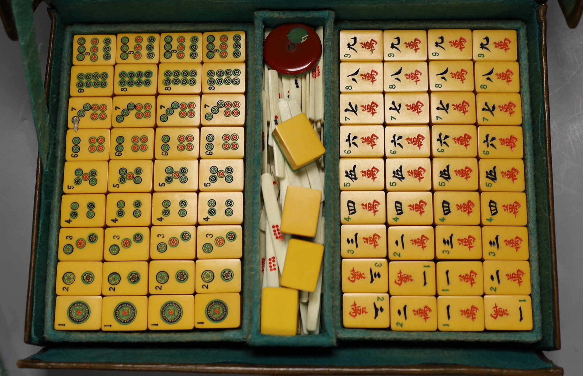 A 1920's leather travelling mahjong set